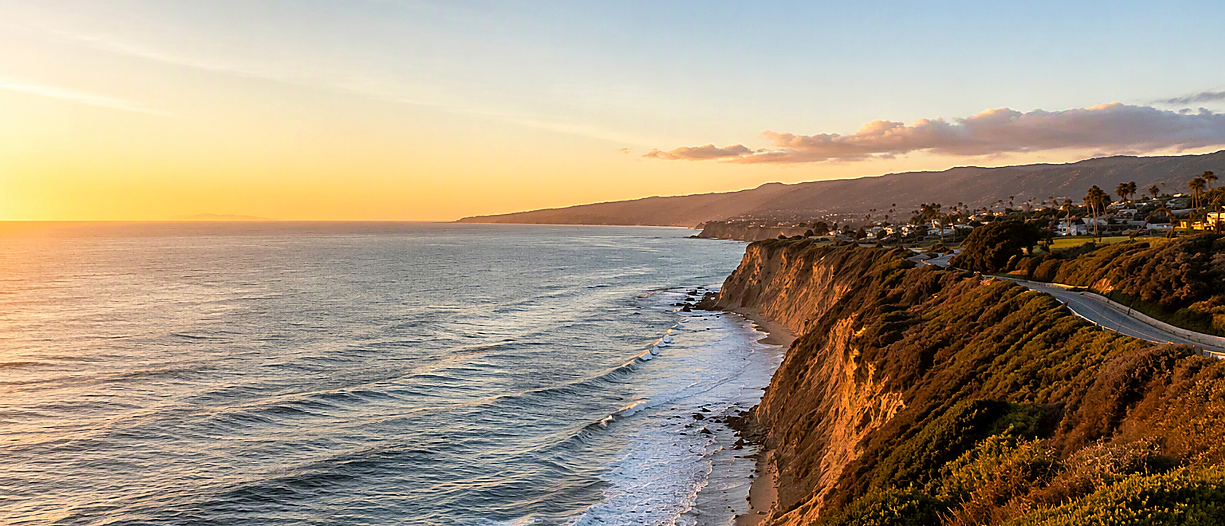 Point Dume and the Malibu coastline in bright daylight above the Pacific